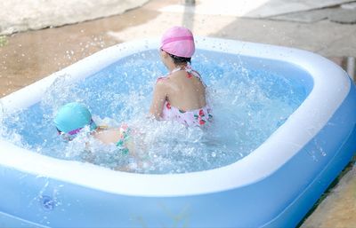 Girl playing in swimming pool