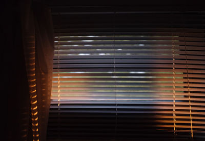 Sunlight streaming through window blinds