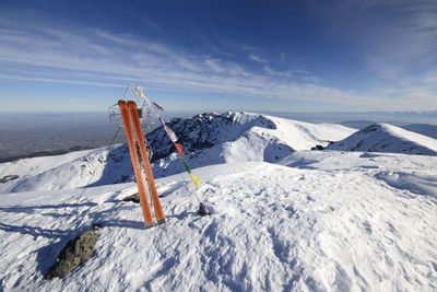 Scenic view of snow covered mountain against sky