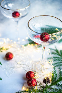 Christmas and new year eve party celebration with champagne glasses and lights