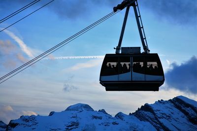 Low angle view of ski lift against sky