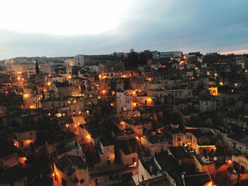 High angle shot of illuminated townscape against sky