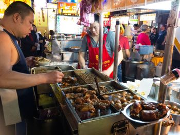 People working at market stall