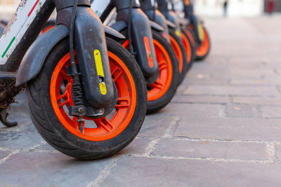 A row of shared electric scooter in an italian square