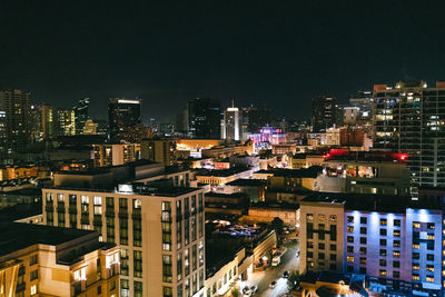 High angle view of illuminated buildings in city at night