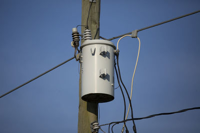 Electrical transformer and wires on an electrical pole