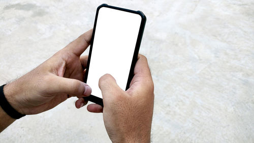 Close-up of man using mobile phone