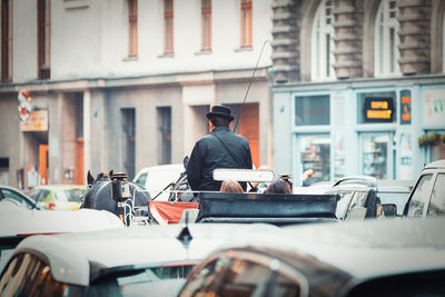 Men in car on street in city