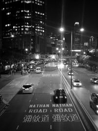 Cars on city street at night
