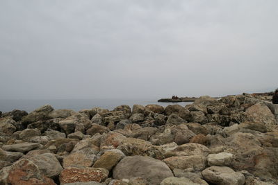 Scenic view of sea and rocks against sky