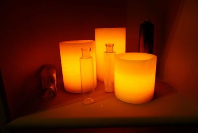 Close-up of illuminated lamp on table