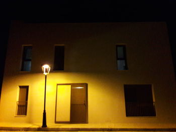 Illuminated street lights at night