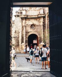 Group of people in front of historical building