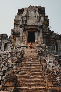 Low angle view of old ruins against sky