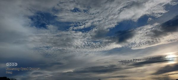 Low angle view of sign against sky