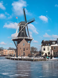 Traditional windmill against sky
