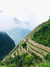 Scenic view of mountain against cloudy sky