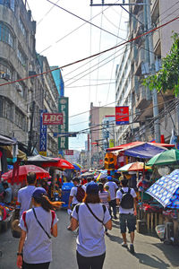 Rear view of people on city street