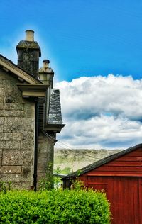 Low angle view of buildings against blue sky