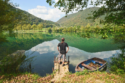 Man standing on old jetty