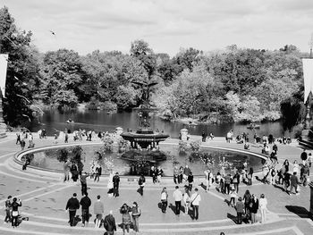 People enjoying in water against sky