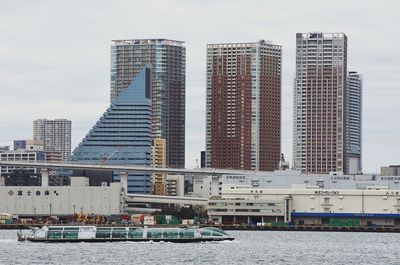 Modern buildings against sky in city