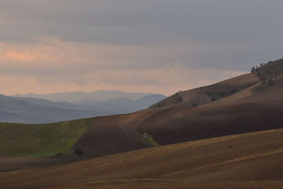 Scenic view of landscape against sky during sunset