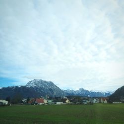 Scenic view of landscape against cloudy sky