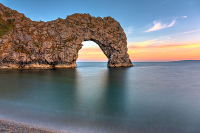The durdle door, part of the jurassic coast in southern england, after sunset