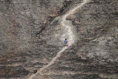 Full length of woman standing on rock