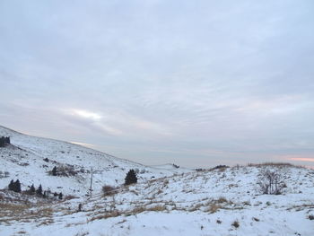 Scenic view of snow covered landscape against sky