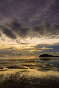 Scenic view of sea against dramatic sky