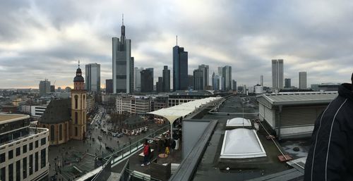 High angle view of cityscape against cloudy sky