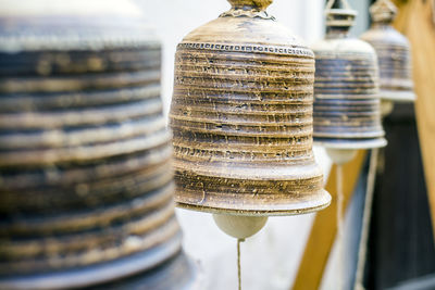 Close-up of bells hanging at temple
