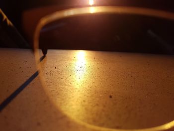 Close-up of tea light on table