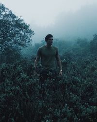 Man standing in forest