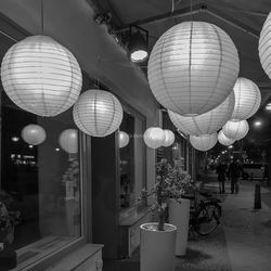 Illuminated lanterns hanging in restaurant