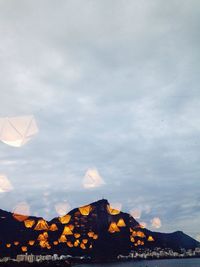 View of mountain range against cloudy sky