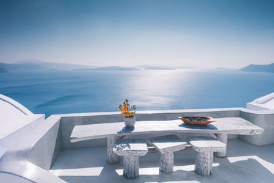 Santorini view with table and chairs