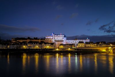 Reflection of illuminated buildings in water at night