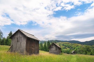 House on field against sky