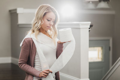 Beautiful woman standing at home