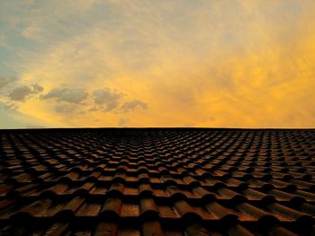Roof against sky during sunset