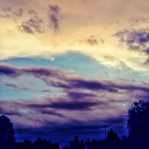 Low angle view of dramatic sky at sunset