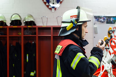 Side view of firefighter wearing helmet