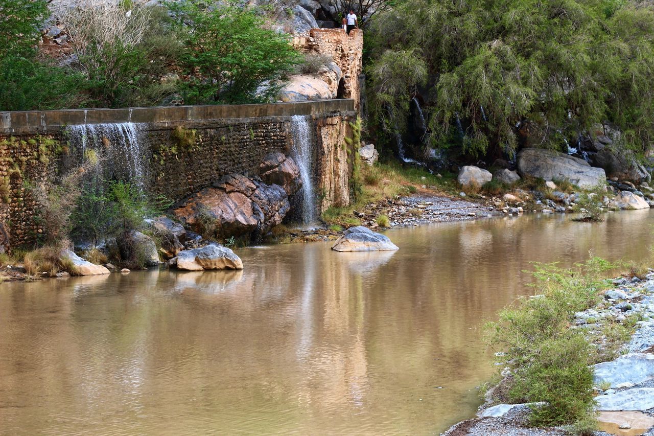 SCENIC VIEW OF LAKE BY ROCKS