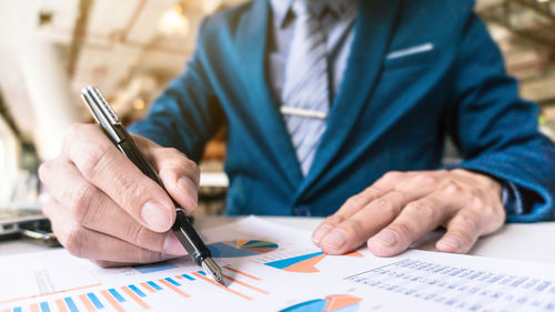 Close-up of man working on table