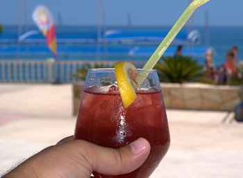 Close-up of hand holding drink