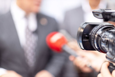Filming media interview, news or press conference with a television camera