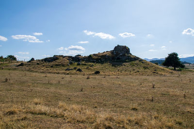 Scenic view of arid landscape against sky